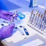 diagnostic-lab-hand-holding-tools-150x150.jpg